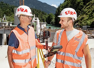 Two surveyors on the building site