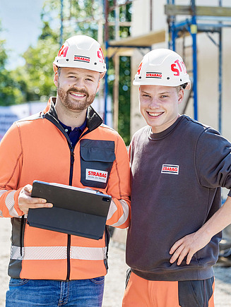 Foto van twee collega's op de werf